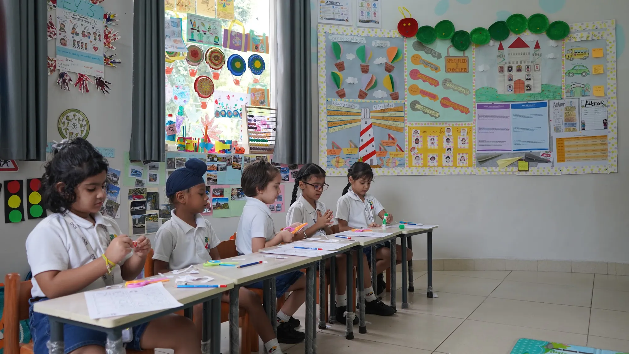 Young students working side by side at their desks