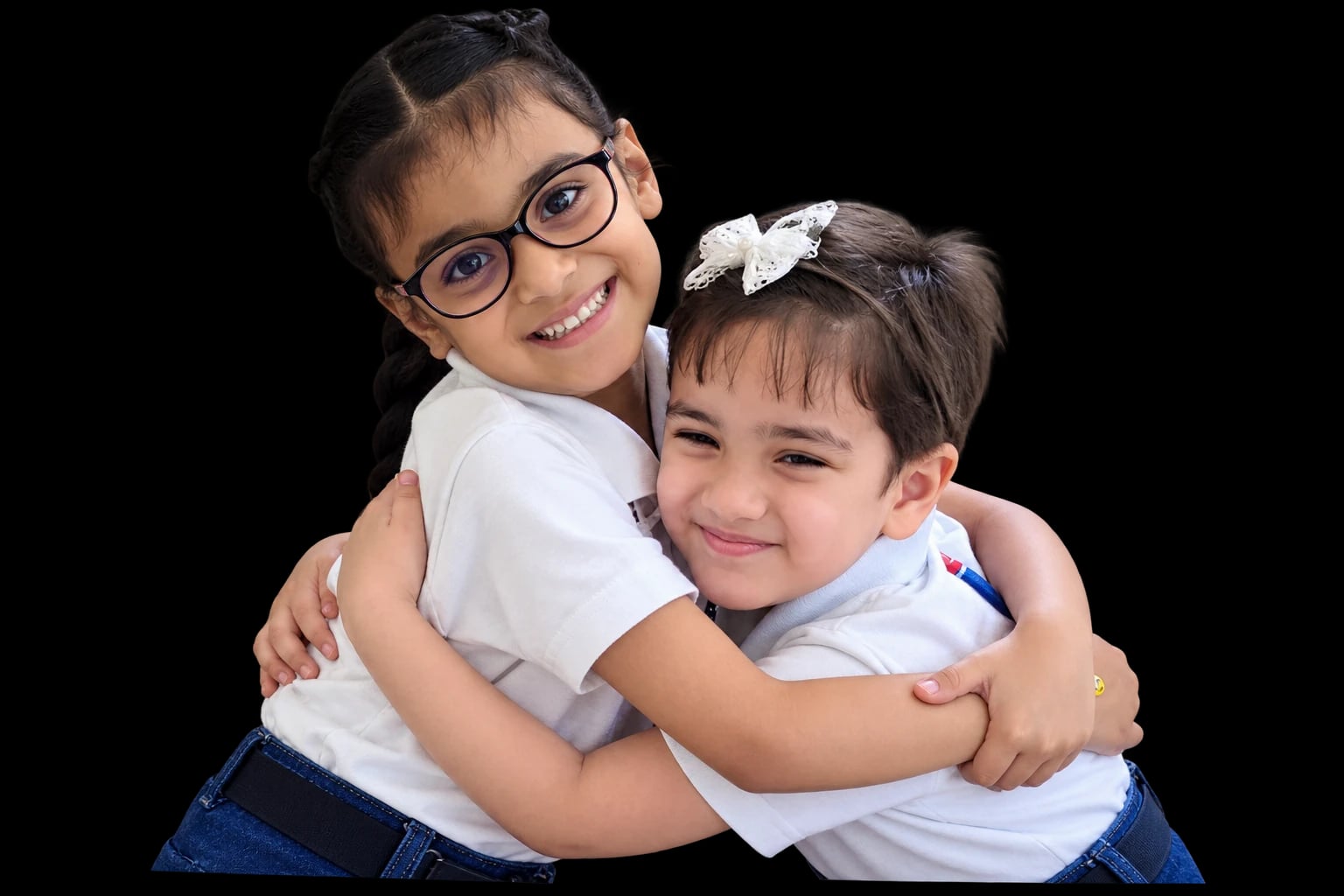 Two smiling SOVO classmates sharing a hug