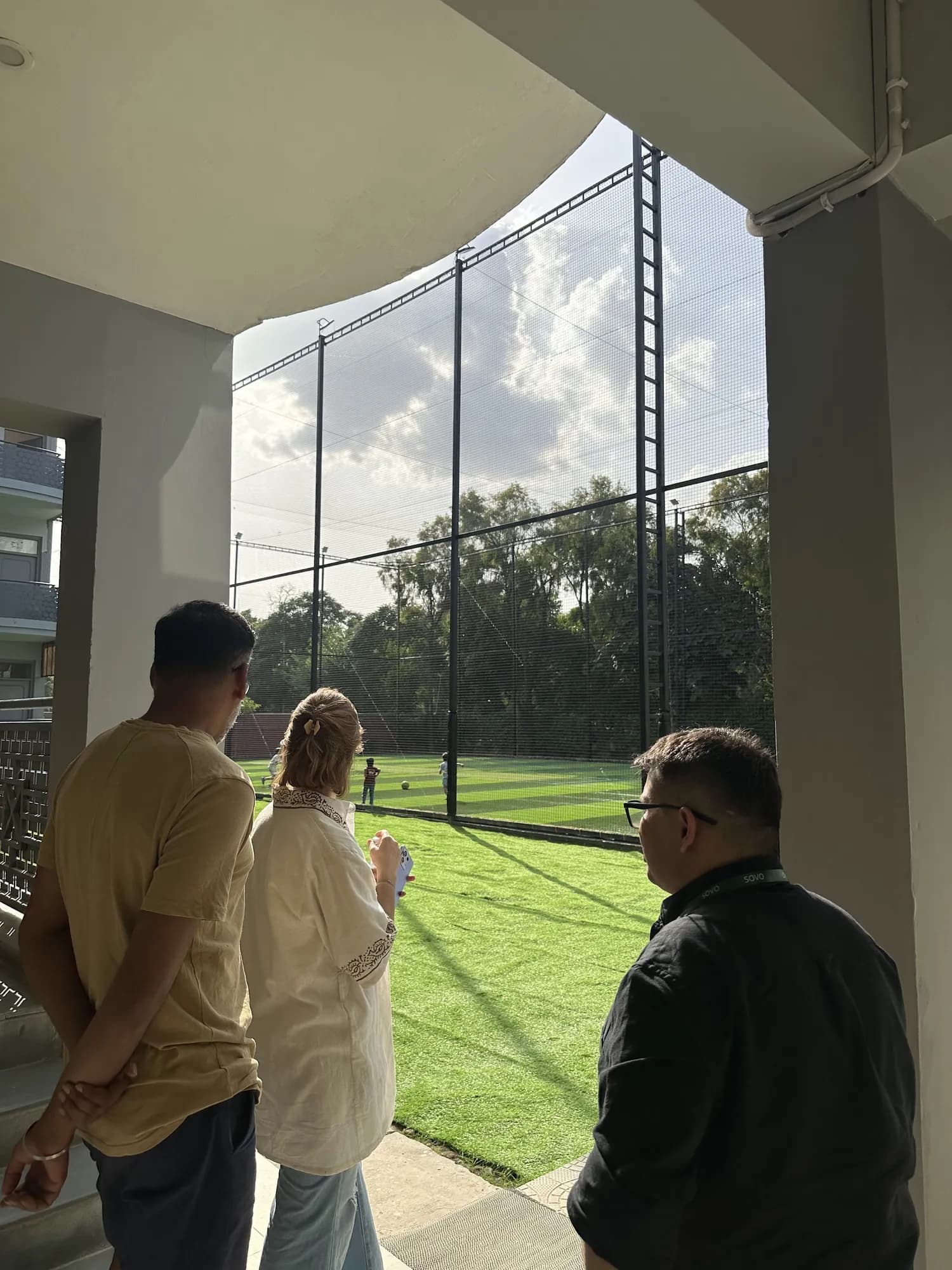 Parents on a campus visit, looking out at the SOVO turf